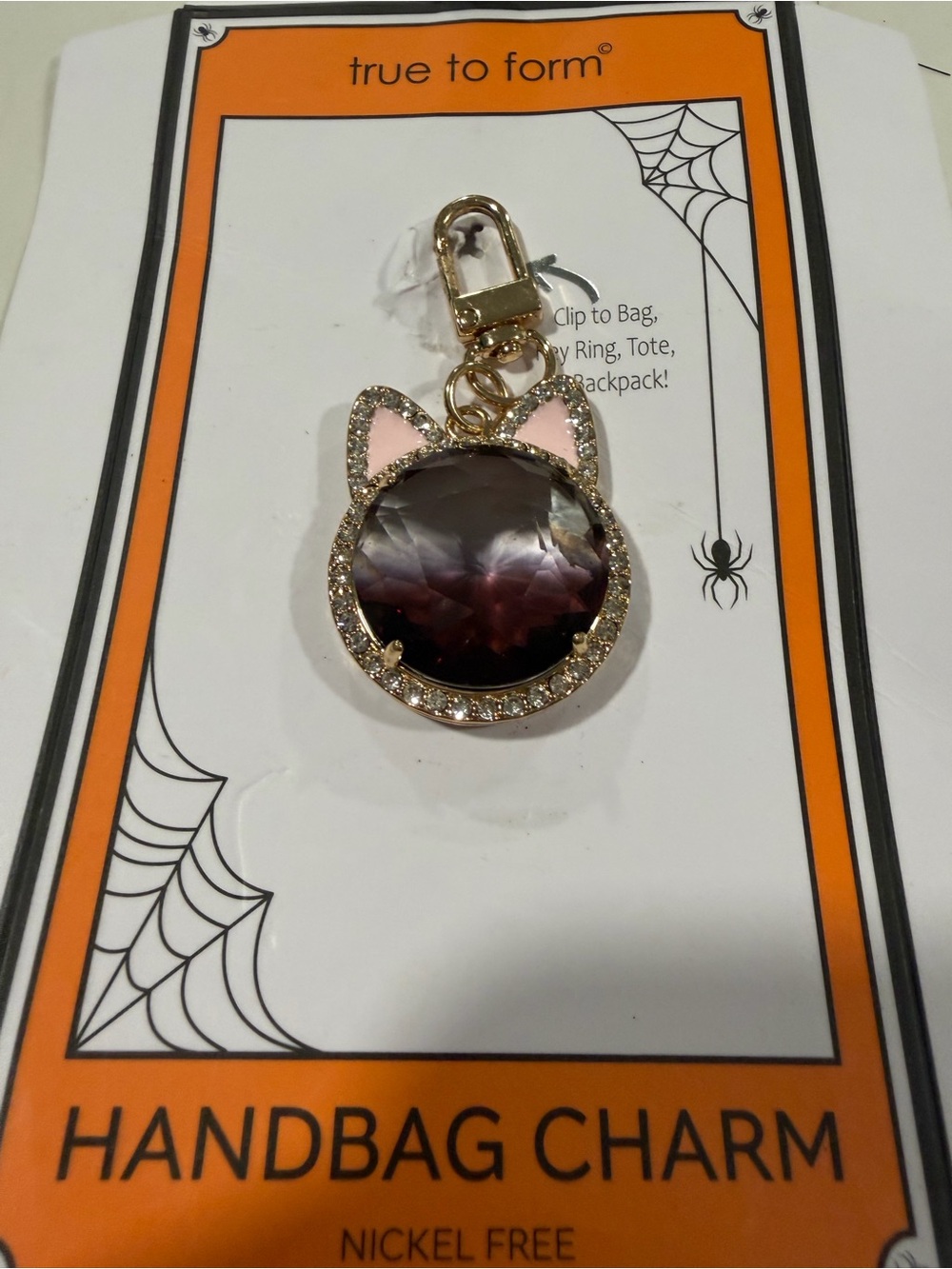 true to form Gold Cat Ear Handbag Charm with Pink Accents and Smoky Gem